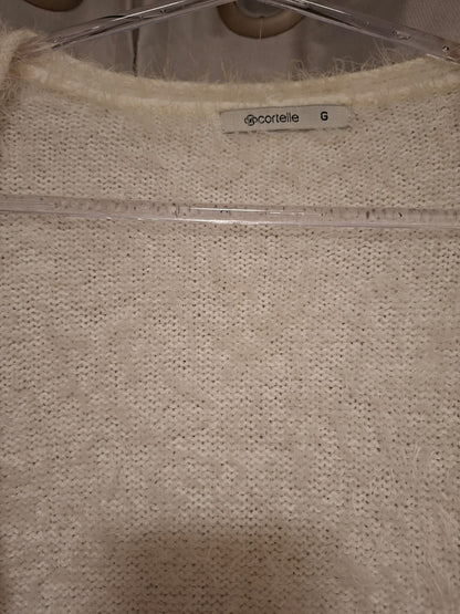 Casaco de lã Cortelle, na cor off, tamanho G( peça smpla),peludinho, com bolso, sem botões, em excelente estado!!!